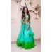 A beautiful lehenga WITH SHADES OF GREEN, MULTI TIERED ruffeled skirt with SCALLOPED DETAILED blouse and NET FRILLED END DUPATTA.