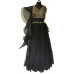 Black net tiered lehenga with a vertical striped embroidered blouse and a wavy tissue wired dupatta