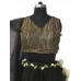 Black net tiered lehenga with a vertical striped embroidered blouse and a wavy tissue wired dupatta