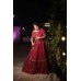 Georgette tiered and gathered lehenga with leather butis all over paired with a pure handembroidered blouse and a net shimmer duatta with border all over.