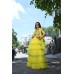 A beautiful Lemon lehenga, 5 tiered ruffeled skirt with 3d handcrafted blouse and high-low sleeves.