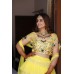 A beautiful Lemon lehenga, 5 tiered ruffeled skirt with 3d handcrafted blouse and high-low sleeves.